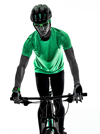 one caucasian man practicing man mountain bike bking isolated on white background with shadowsの写真素材
