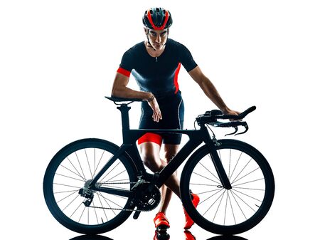 triathlete triathlon Cyclist cycling in studio silhouette shadow isolated on white backgroundの写真素材