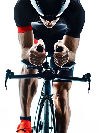 triathlete triathlon Cyclist cycling in studio silhouette shadow isolated on white backgroundの写真素材