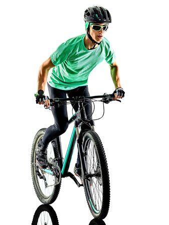 one caucasian man practicing man mountain bike bking isolated on white background with shadowsの写真素材