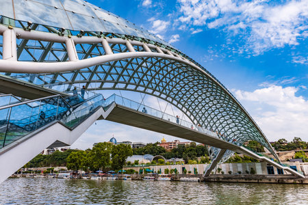 Tbilissi , Georgia - August 25, 2019 : people tourist on The Bridge of Peace landmark of Tbilissi...