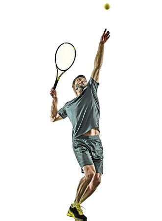 one caucasian mature tennis player man serving service in studio isolated on white backgroundの写真素材