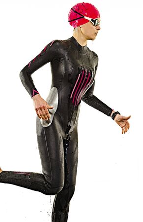 one caucasian woman practicing triathlon triathlete ironman swimmer swimming swimsuit studio shot isolated on white backgroundの写真素材