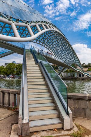 Tbilisi , Georgia - August 25, 2019 : people tourist on The Bridge of Peace landmark of Tbilisi Georgia capital city eastern Europeのeditorial素材