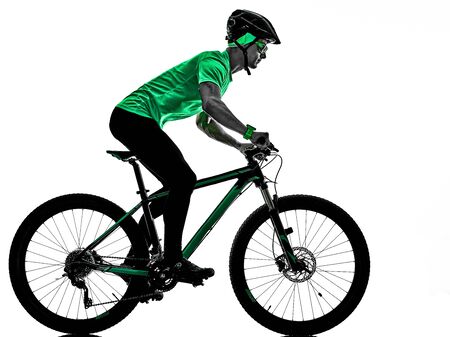 one caucasian man practicing man mountain bike bking isolated on white background with shadowsの写真素材