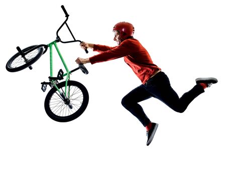 BMX rider cyclist cycling freestyle acrobatic stunt isolated white backgroundの写真素材
