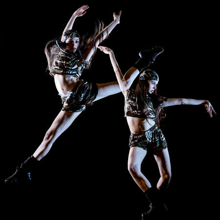 young woman modern dancer dancing isolated black background light paintingの写真素材