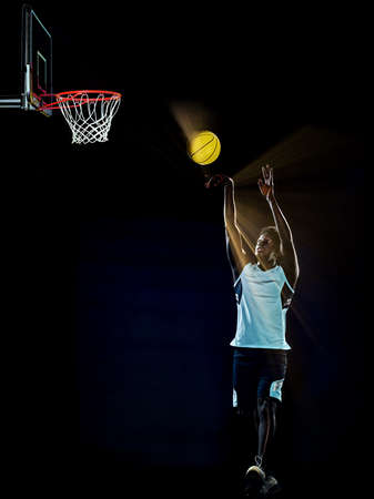 young african basketball player man isolated black backgroundの写真素材