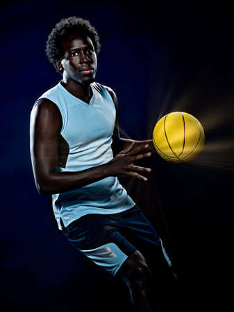 young african basketball player man isolated black backgroundの写真素材