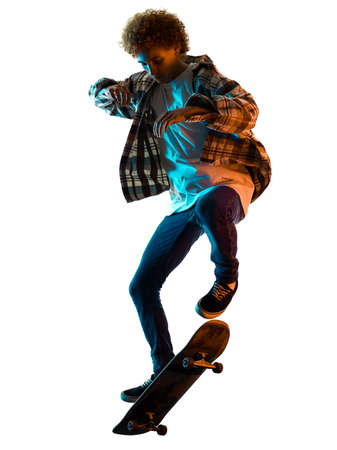 young man skateboarder Skateboarding isolated white background shadow silhouetteの写真素材
