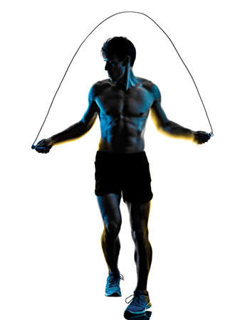 young man fitness exercise exercIsing shadow isolated white background silhouetteの写真素材