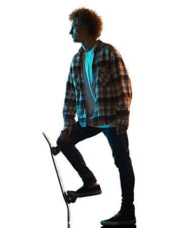 young man skateboarder Skateboarding isolated white background shadow silhouetteの写真素材
