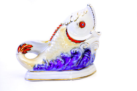 antique porcelain figurine fish on the waveの写真素材