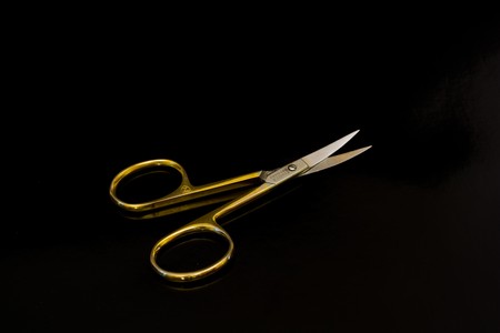manicure scissors on a black backgroundの写真素材