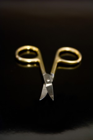 manicure scissors on a black backgroundの写真素材