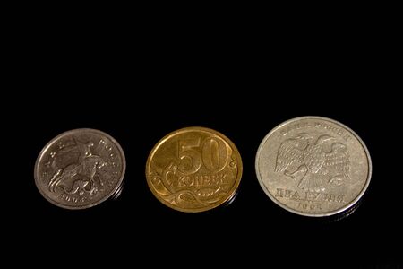 Ruble, penny, coin, three on a black background herbの写真素材