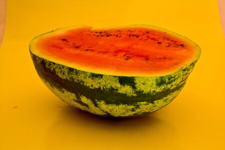watermelon in half term on a yellow backgroundの写真素材