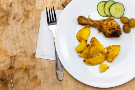 Baked chicken drumsticks on a baking sheet on a white background. Top viewの写真素材