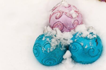 christmas balls on snow backroundの写真素材