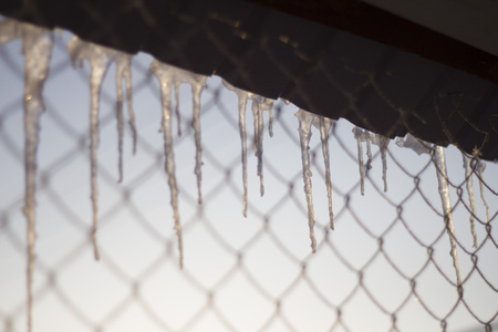icicles with roof meshの写真素材