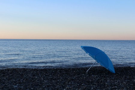 Blue umbrella on the beachの写真素材