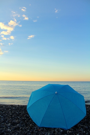 Blue umbrella on the beachの写真素材