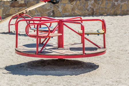 Children's playground, swing in the sand, summer