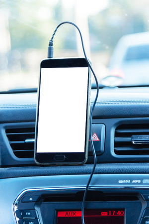 phone and mounted holder in car on rural road. gpsの写真素材