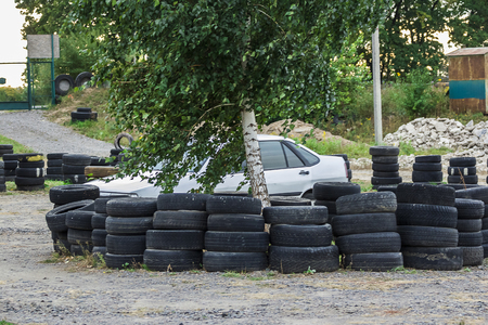 Driving school, driver training, road of the old car tiresの写真素材