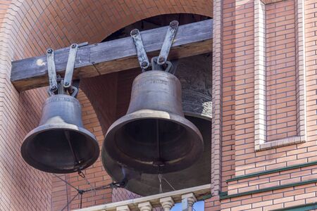 Vintage bronze church bells hangingの写真素材