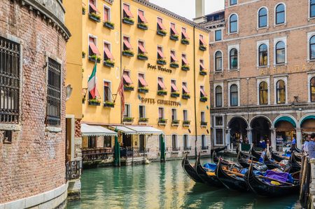Venice, Italy - April 26, 2013: The parked gondolas are on water channel in Venice, Italy. Hotel Cavalletto, Bacino Orseolo Gondole, Venice, UNESCO World Heritage Site, Veneto, Italy, Europeのeditorial素材
