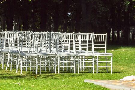 Beautiful wedding decorations for the ceremony outside in sunny weatherの写真素材