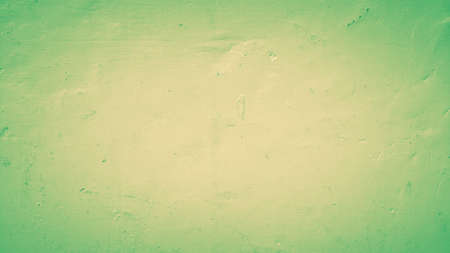 texture background of wall cement green yellow colorsの写真素材