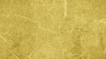 texture background of yellow wall cementの写真素材