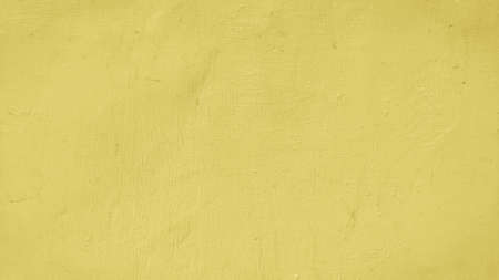 texture background of yellow wall cementの写真素材