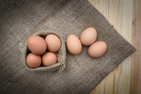 Studio shot eggs on wood sack bag and background