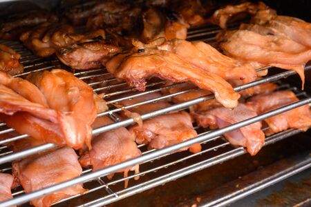 machine are grilled chicken, whole chicken in local marketの写真素材