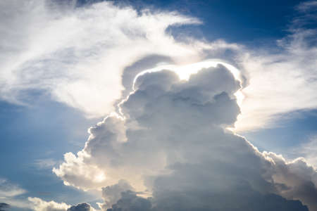 Blue sky with clouds and sunの写真素材