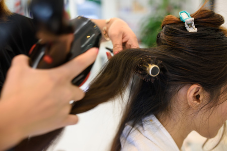 Hands of professional hair stylistの写真素材