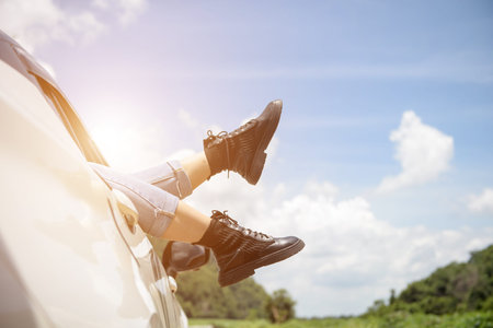 photo of leg woman in car during morning time holiday