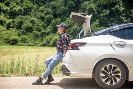 photo of leg woman in car during morning time holidayの写真素材
