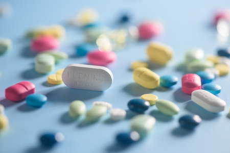 Pharmacy background on a  table. Tablets on a blue background. Pills. Medicine and healthy. Close up of capsules. Different kind of medicinesの写真素材