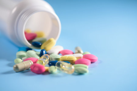 pills with bottle isolated on blue background