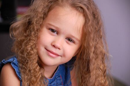 Little blond girl portrait smilingの写真素材