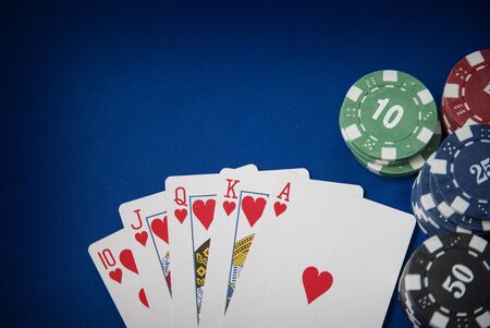 Gambling chips frame on Blue card table backgroundの写真素材