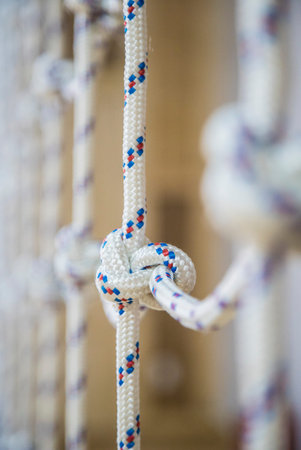 Playground rope, climbing nets and wooden background