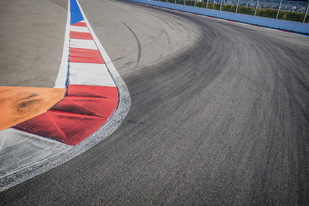 Texture of motor race asphalt and red white curb. Close up on F1 Grand Prix street circuitの写真素材