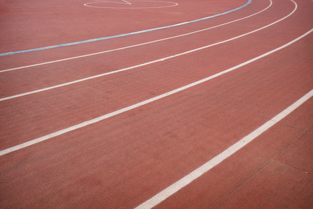 Red running track in stadium for athlete, jogging, relax, walk and runningの写真素材