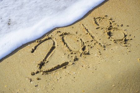 Abstract 2018 on a beach sand backgroundの写真素材