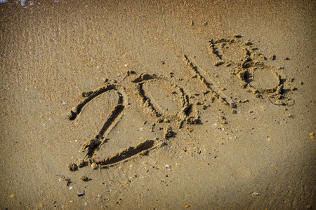 Abstract 2018 on a beach sand backgroundの写真素材